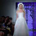 Titling her bridal collection “This Magic Moment,” Reem Acra focuses on crafting each bride her dream wedding dress! With a play on lingerie, her exquisite signatures of embroideries, luxurious lace […]